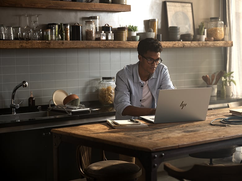 Working On Laptop In Kitchen