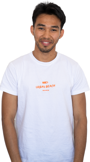 Young man looking into the camera and smiling.