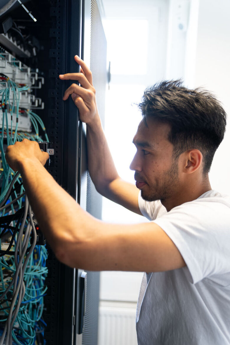 Young man working on IT System